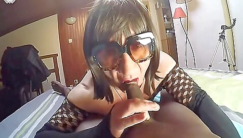 Ebony babe wearing stockings and deepthroating in a video